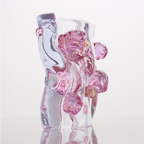 abstract shaped glass sculpture in white and pink