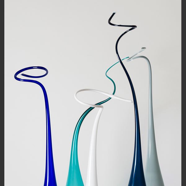 tall thin abstract glass sculptures on steel base in white blue turquoise dark green and grey