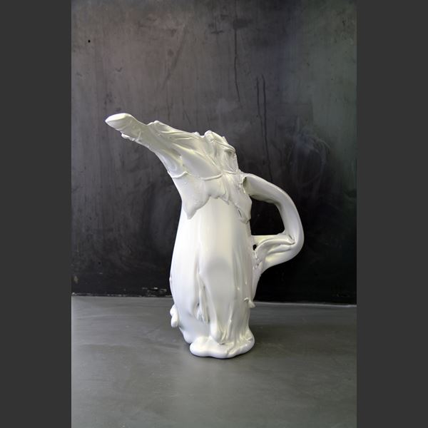 abstract shaped glass sculpture in pearly white of a pitcher