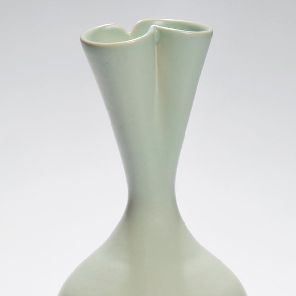 tall green ceramic sculpture of seed pod with twin necked top
