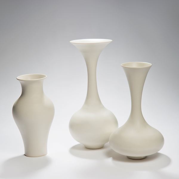 white vase ornament sculpture with wider upper mid section