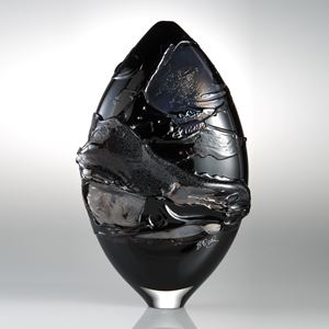 black oval shaped art glass sculptural vessel with gold splashes