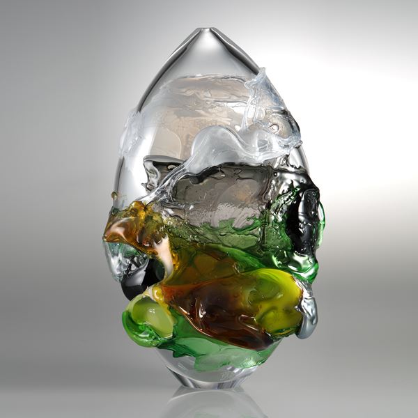 sculpted clear glass decorative art piece with dark green yellow and orange splashes