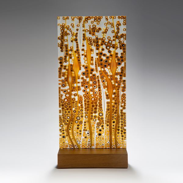 fused glass art panel in autumnal colours on wood block