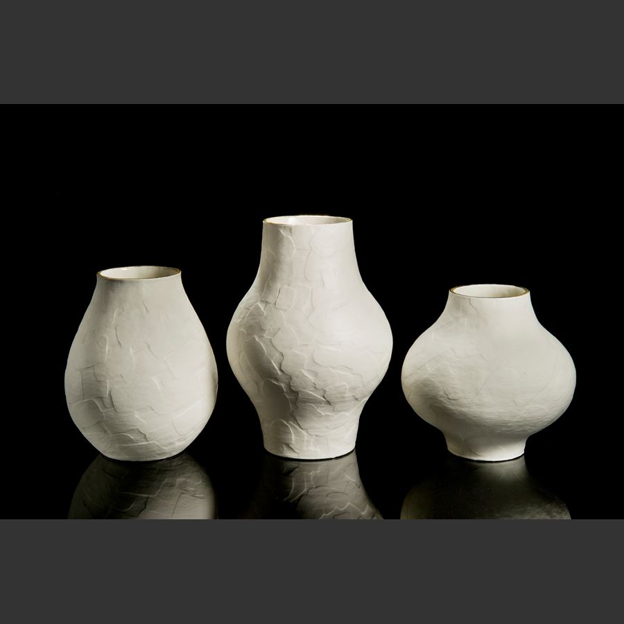 porcelain ceramic sculptured vessel with wider midriff