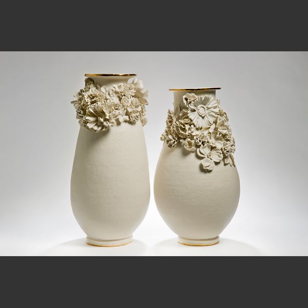 sculpted white medium sized porcelain vase with flower decoration