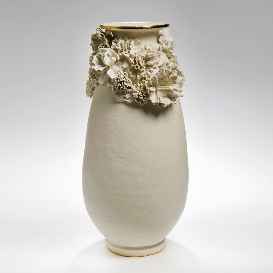 tall ceramic vase in white with flower decoration