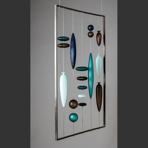 glass hanging wall artwork with small pieces held by wire inside metal frame