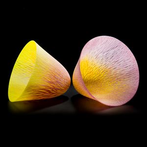 two art glass cone shaped vessels in yellow and pink