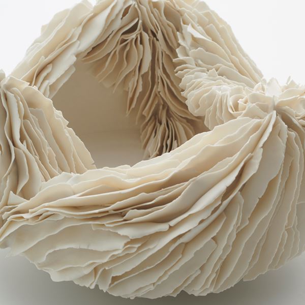 white porcelain art sculpture of an open bowl with layered edges