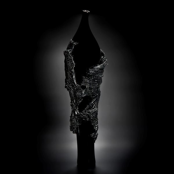 glass artwork of grey cloak on black model