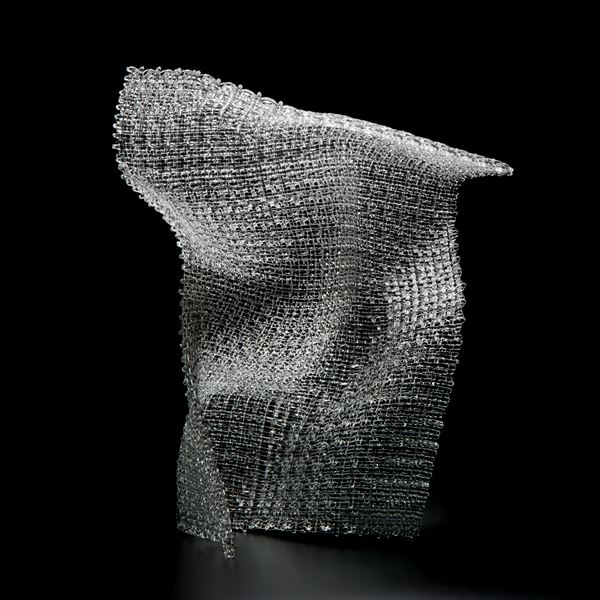 layered and fused modern art glass sculpture resembling cloth stood upright