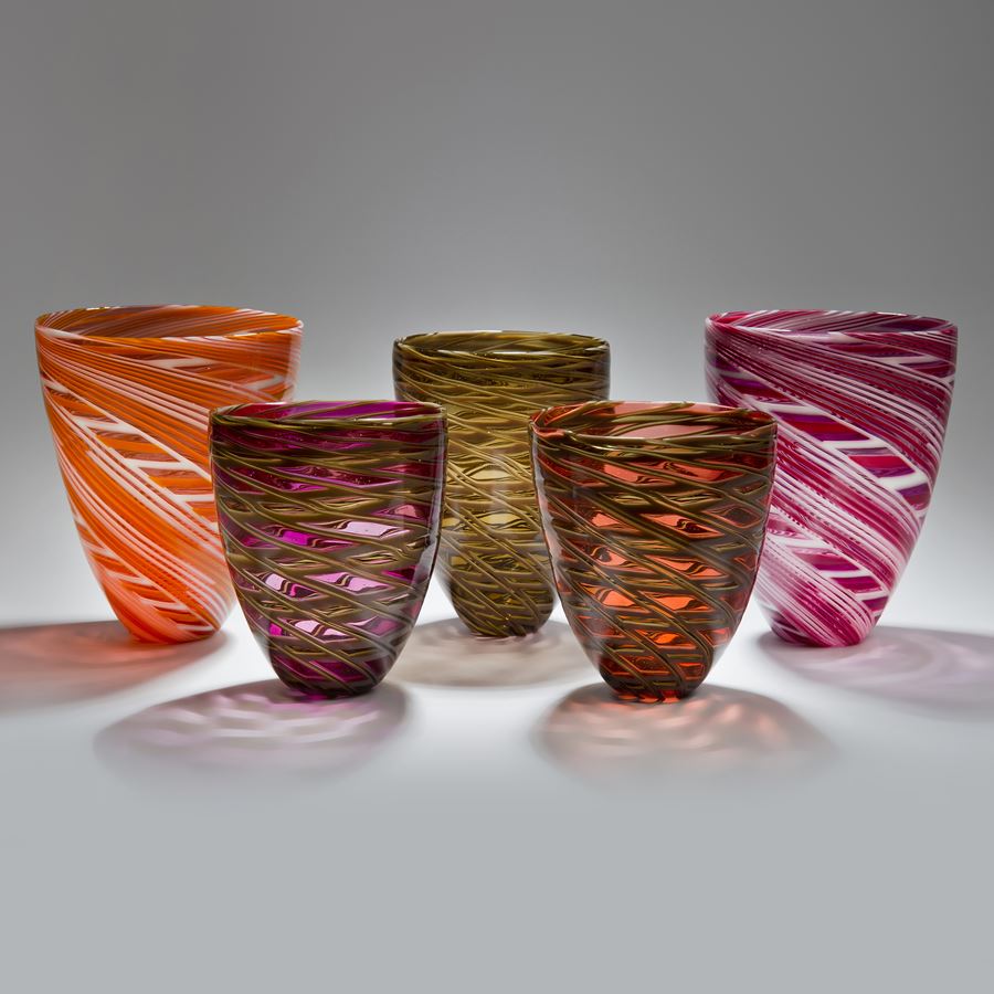 collection of free-blown art-glass short vases in orange pink and grey shades