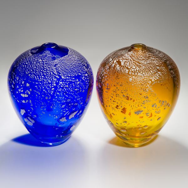 colourful apple shaped glass sculptures with silver speckles