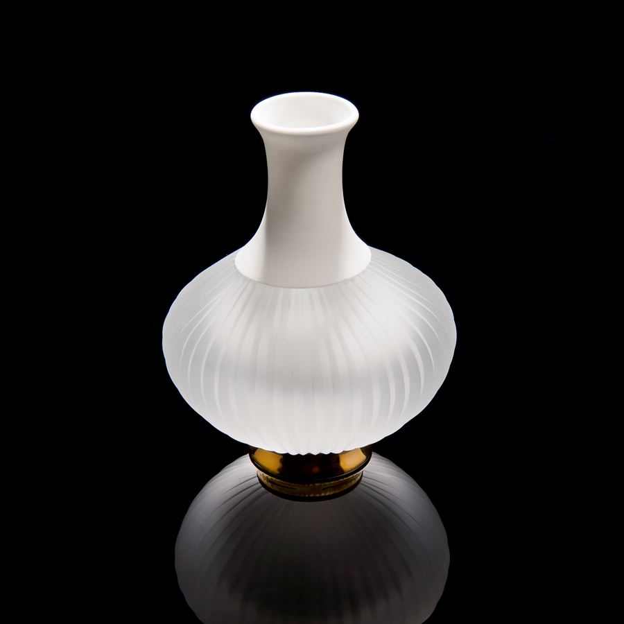 sculpted glass and porcelain vessel with wide base and long neck on gold base