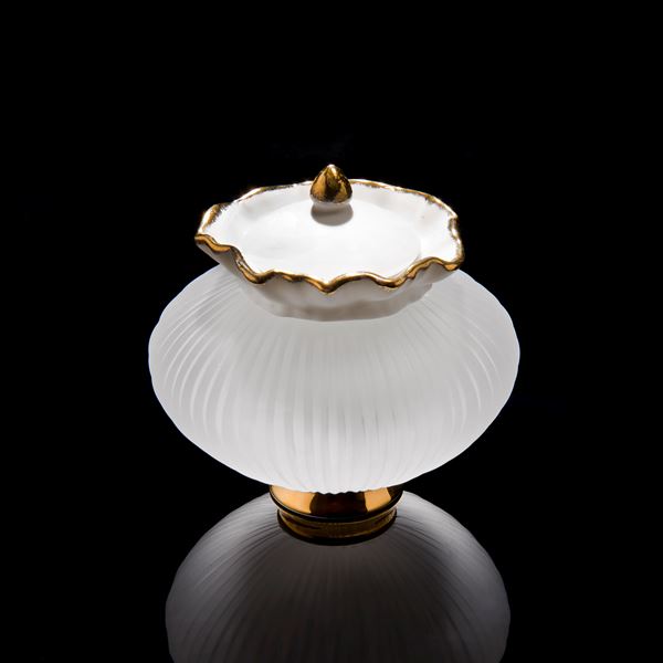 small glass and porcelain artwork of teapot with gold base and trim
