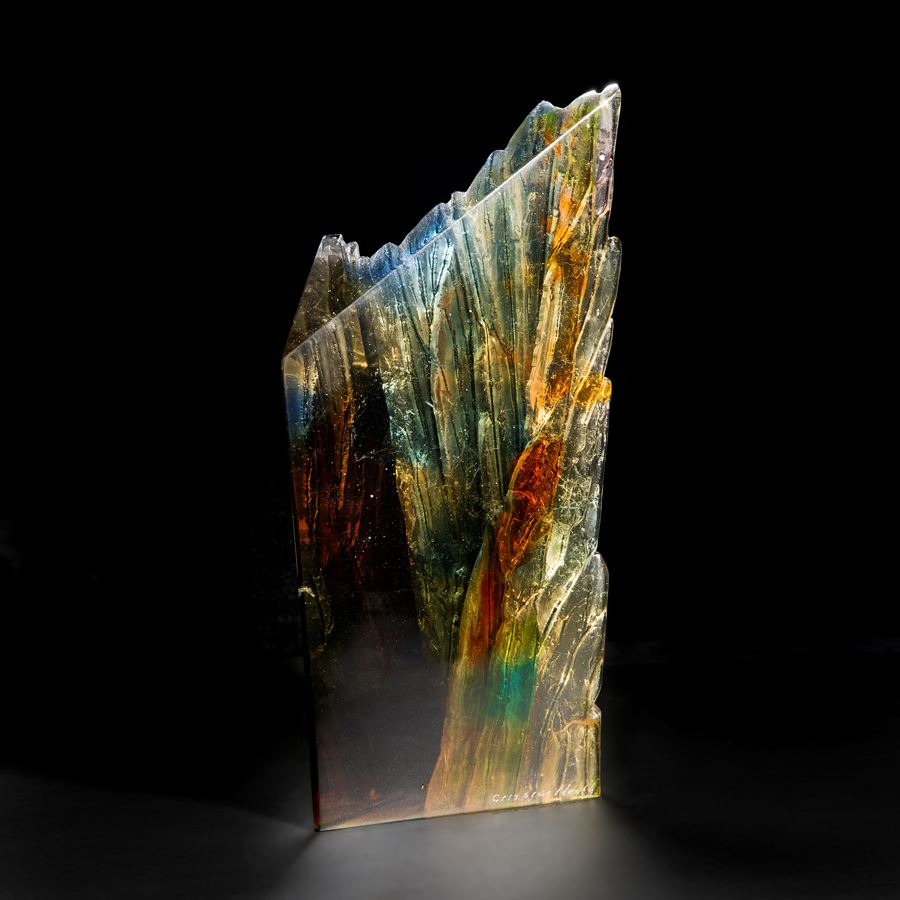 modern art glass centrepiece sculpture of cliffs in multicoloured autumnal shades