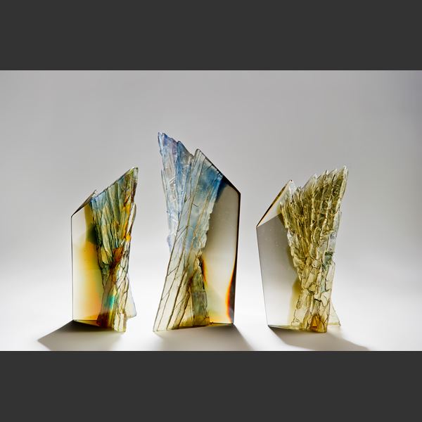 modern art glass centrepiece sculpture of cliffs in multicoloured autumnal shades