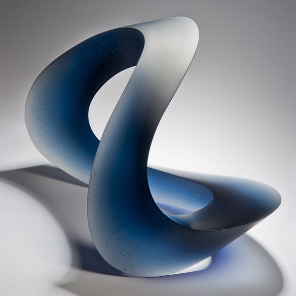 contemporary abstract art-glass sculpture of wave form in blue