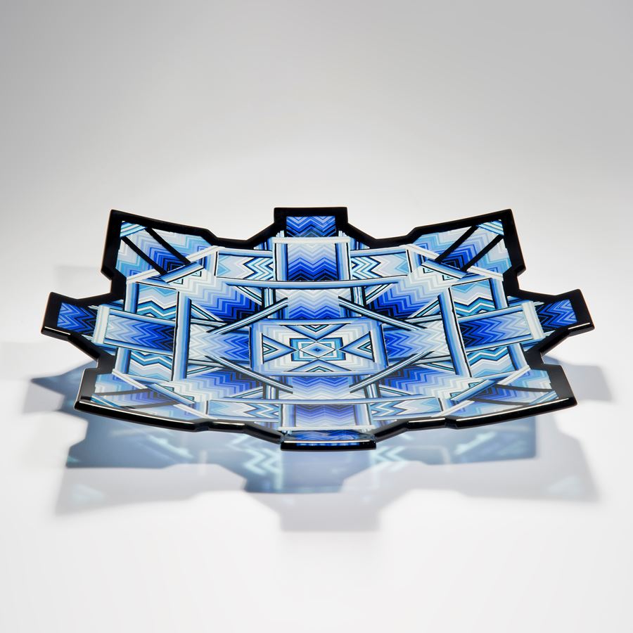 blue black and turquoise art-glass sculpture of flat bowl with pointed edges