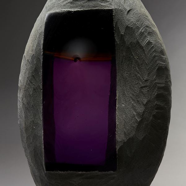 modern oval shaped art glass and metal sculpture in grey with rectangular purple centre