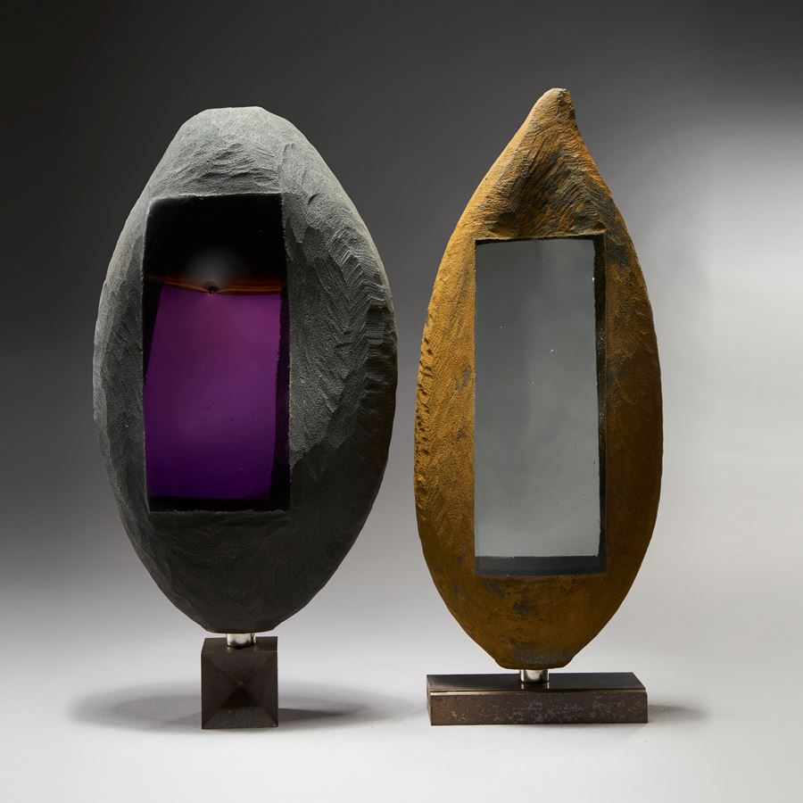 modern oval shaped art glass and metal sculpture in grey with rectangular purple centre