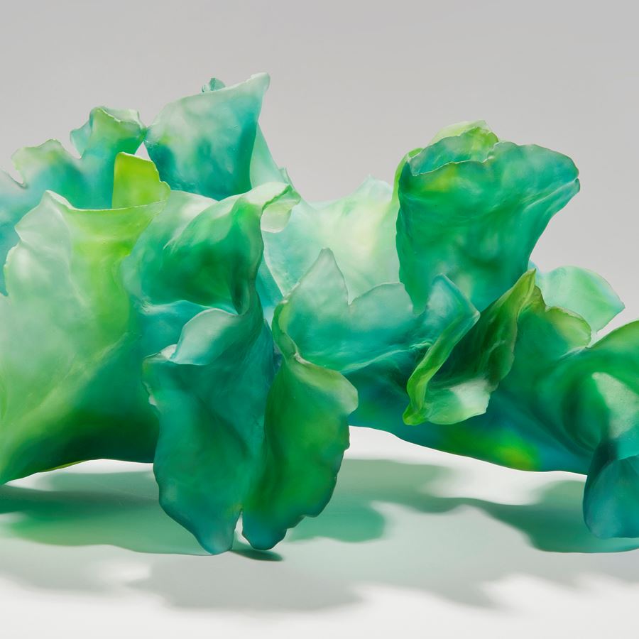 contemporary art-glass sculpture of leaves in bright green