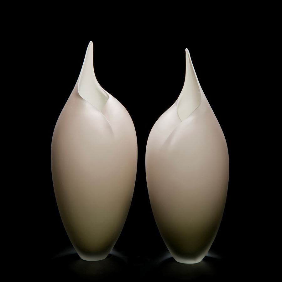 two modern art glass sculptures in bird like shape in white and light grey
