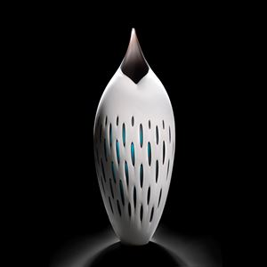 art glass sculpture of bird like shape in white and black