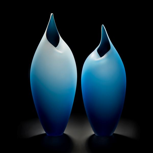 minimal blown glass sculpture of two birds in blue