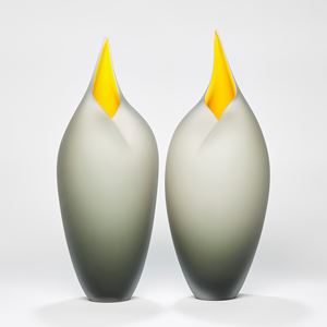 minimalist blown glass sculpture of birds in bronze and yellow
