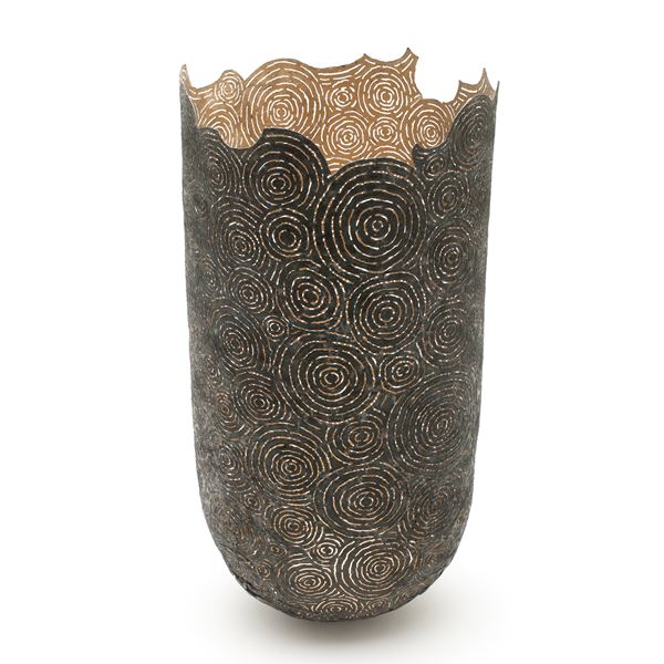 tall open top sculpted vessel made from circular cut pieces of metal and wood