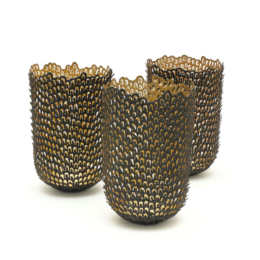 three steel and gold vase sculptures made from small pieces of stacked steel and gold 
