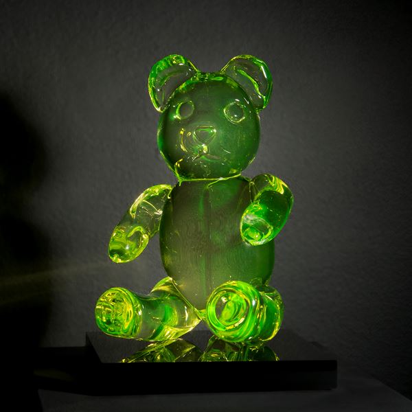 neon green coloured glass art sculpture of teddy bear