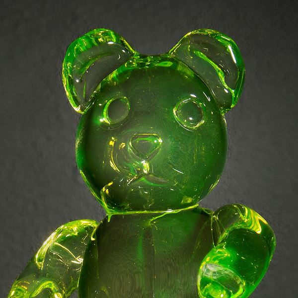 neon green coloured glass art sculpture of teddy bear