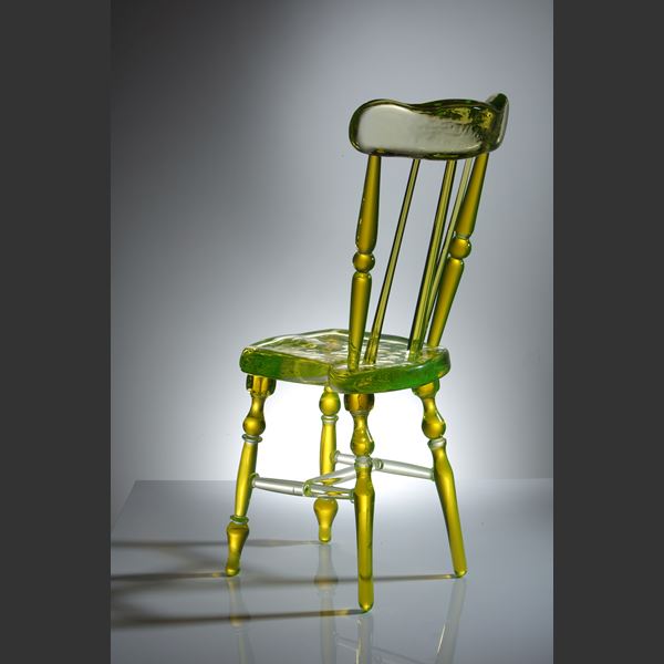 neon green coloured art glass sculpture of a chair
