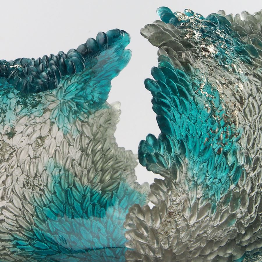 turquoise and clear art glass concave sculpture of wave shape
