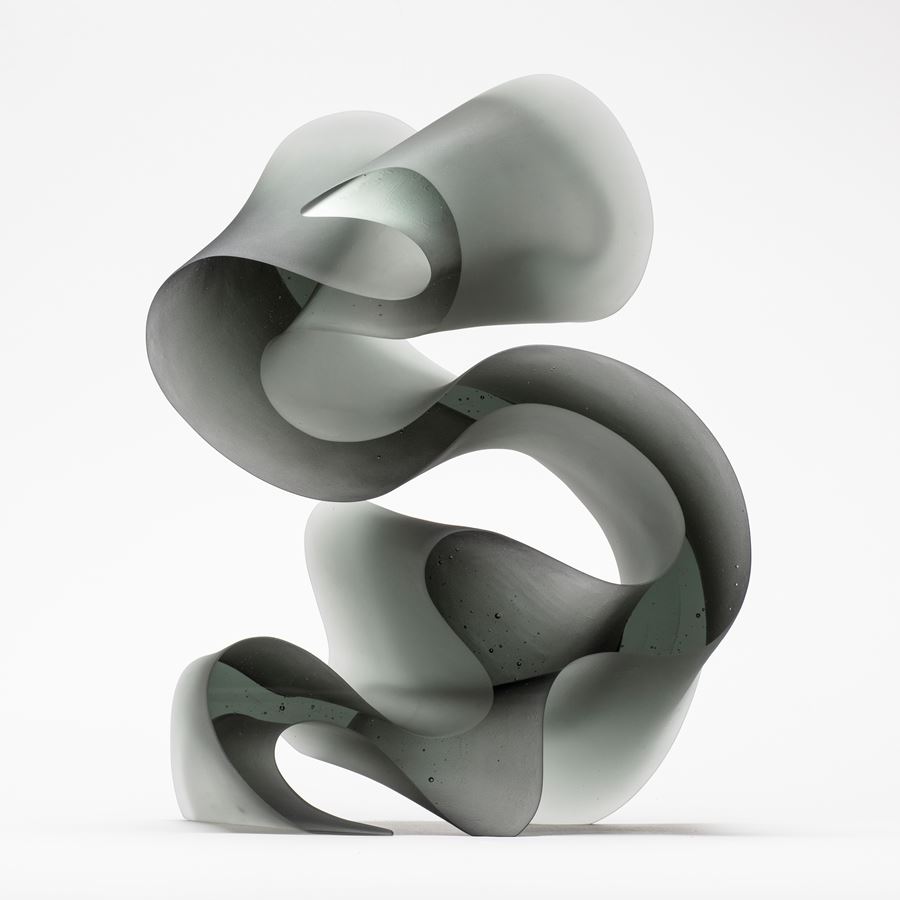 contemporary abstract glass art sculpture of swirly line in grey