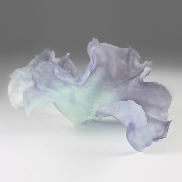 delicate cast glass sculpture of leaf in light purple and green