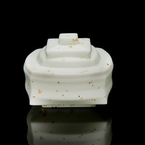 white cast glass sculptural art container with lid with gold speckles