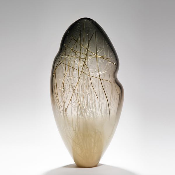 seethrough tall art glass sculpture with internal structure resembling abstract winter scene