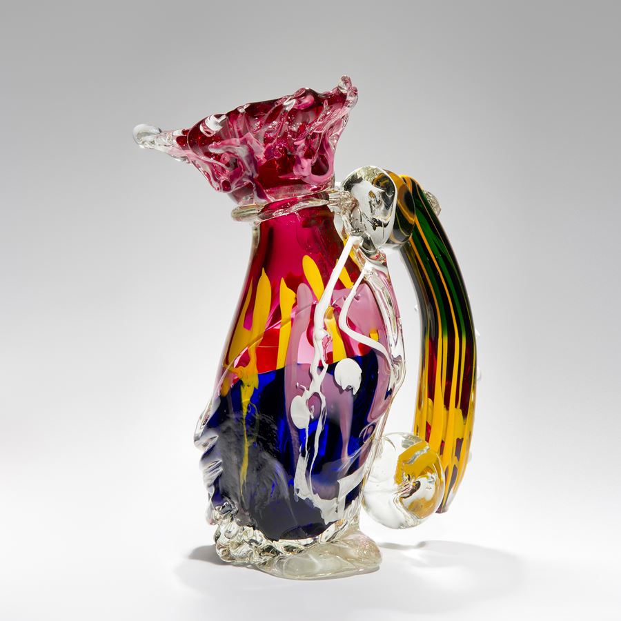 bright multicoloured ornamental art-glass sculpture of a jug