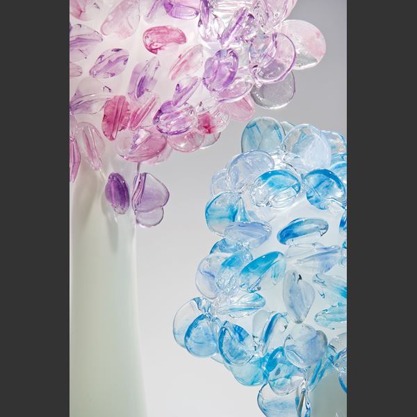 art glass sculpture of flowers in blue and pink