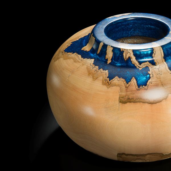 sculpted sycamore wood vessel with blue metal inlay