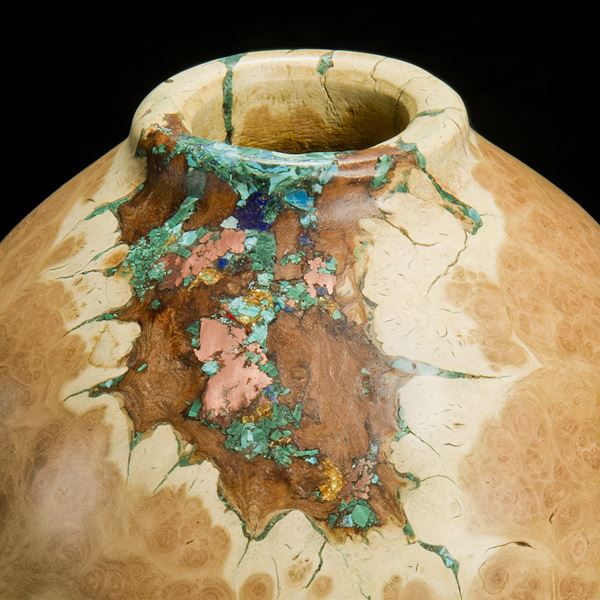medium height sculpted acacia wood vessel with precious mineral inlay in natural looking browns and turquoise