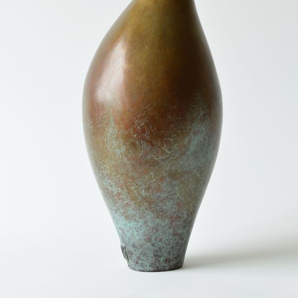 contemporary bronze vessel sculpture with long thin neck