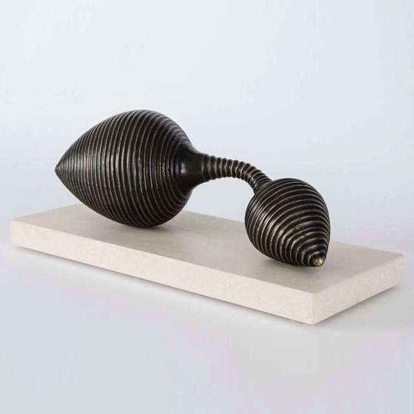 two ended conical terminal bronze sculpture on limestone base