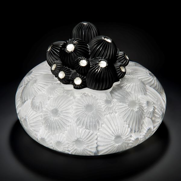 white star coral themed glass artwork with black berries protruding from centre