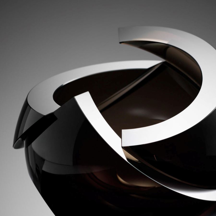 modern minimalist spherical art glass sculpture with sharp cuts in black
