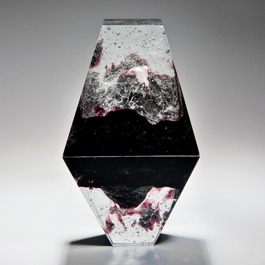 diamond shaped art-glass sculpture with plaster insert resembling frozen form in black crystal red 